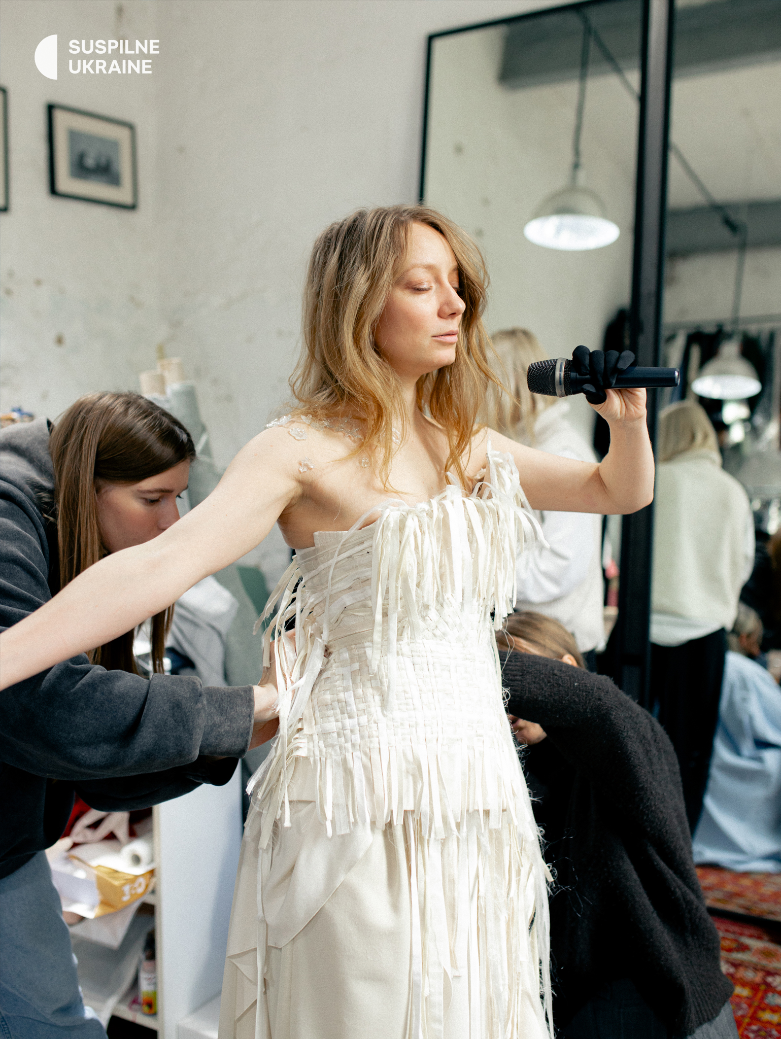 LELÉKA during a suit fitting